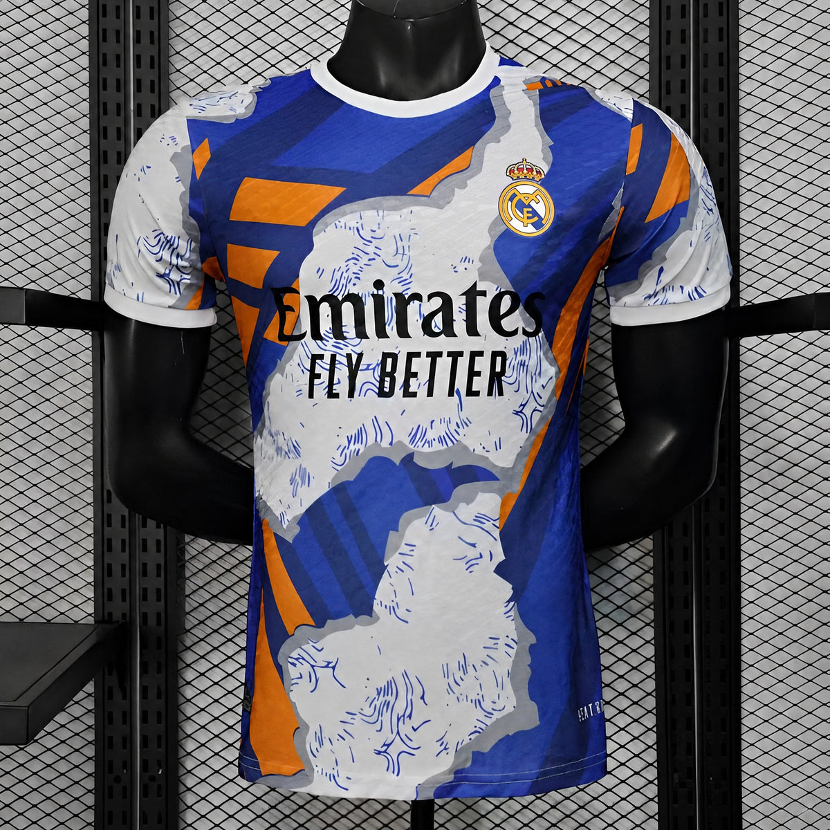MAILLOT REAL MADRID PLAYER 25/26 BLEU ET ORANGE ABSTRAIT